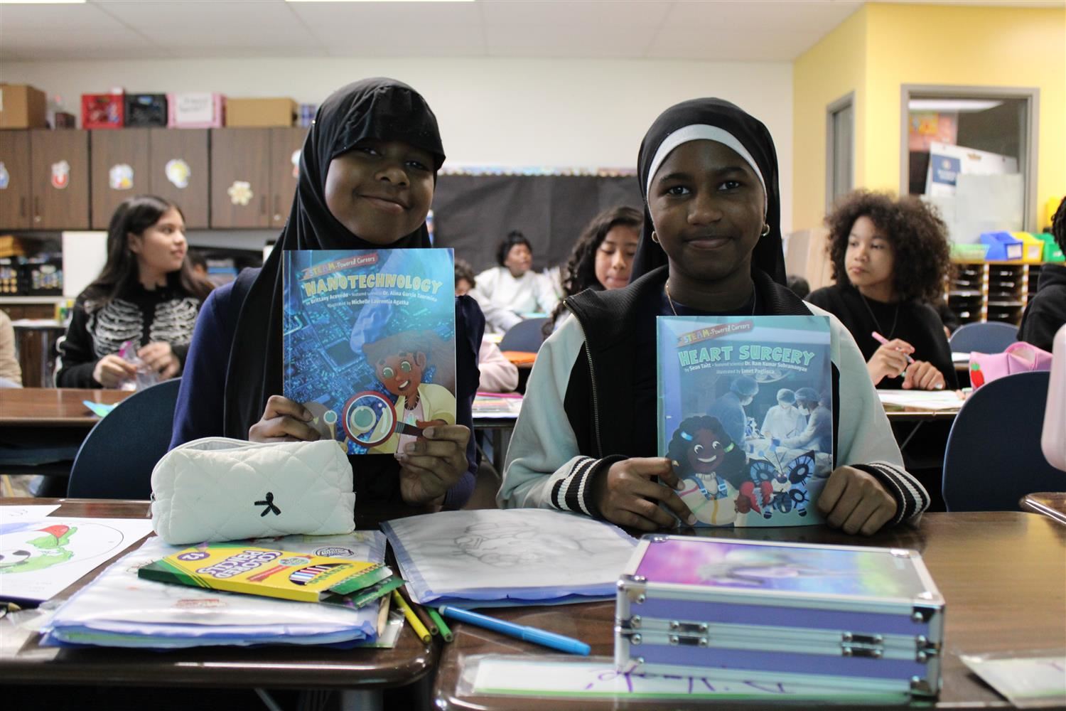 girls holding books