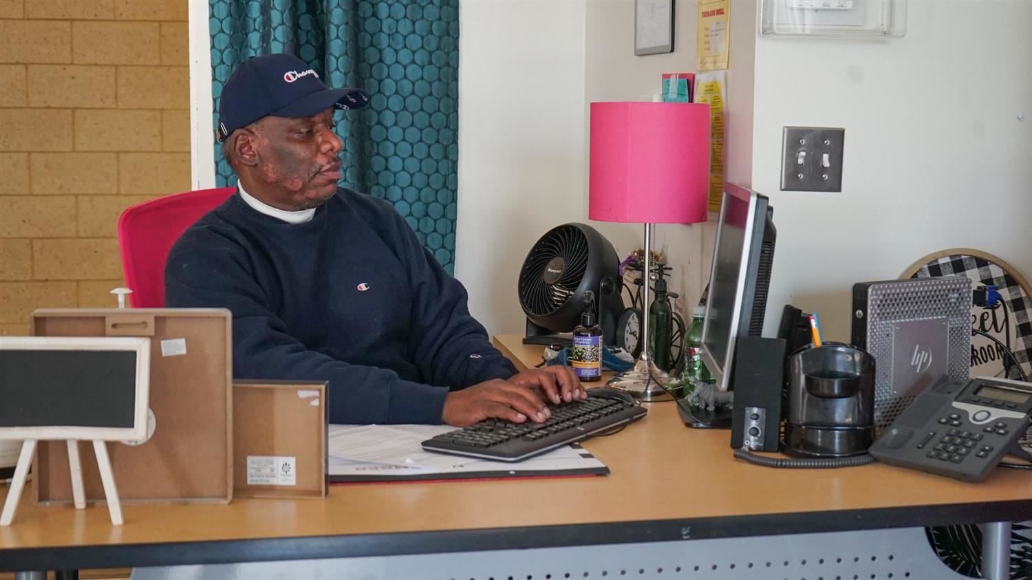 Wilbert Norman working at desk