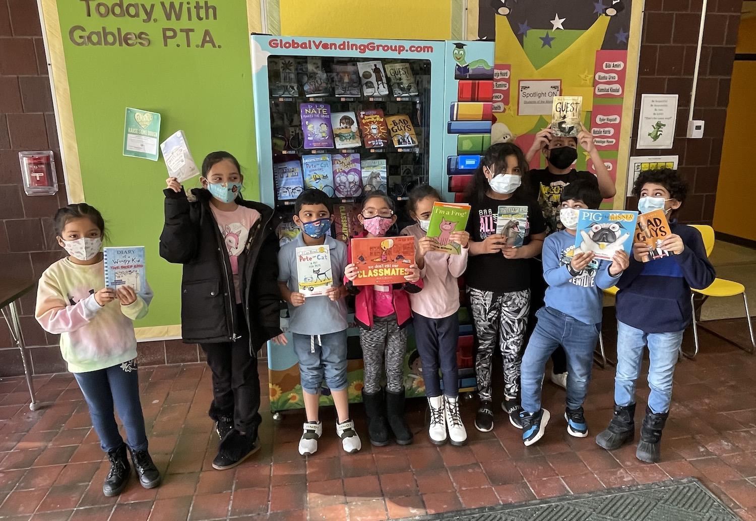 Kids Using Book Vending Machine