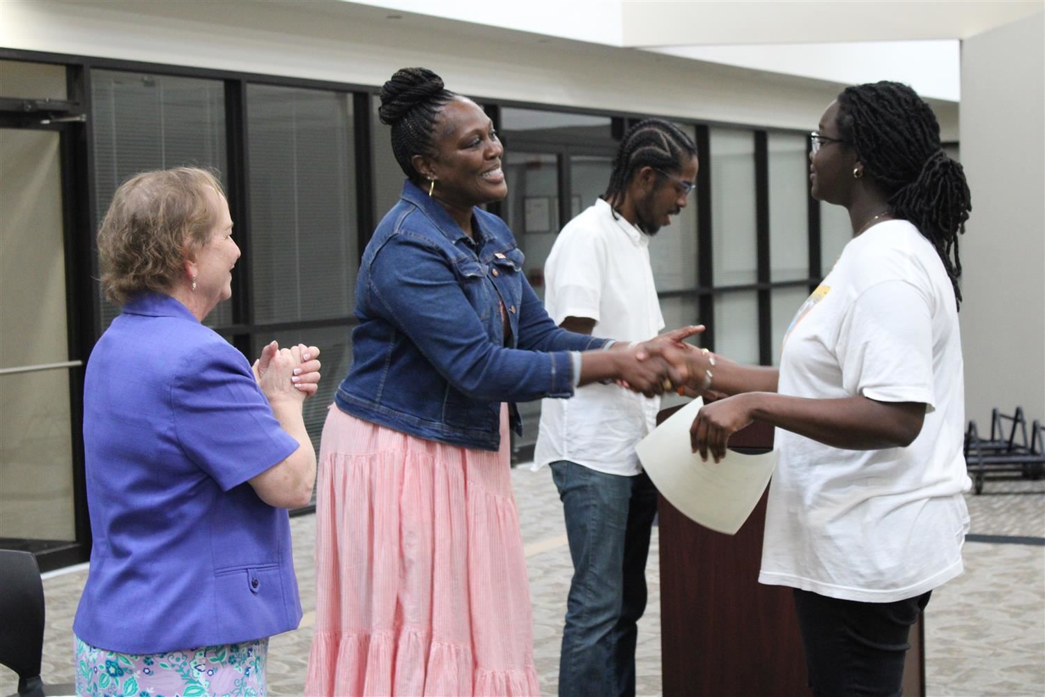 CCS Superintendent Dr. Talisa Dixon shakes hand with a student intern from CCS