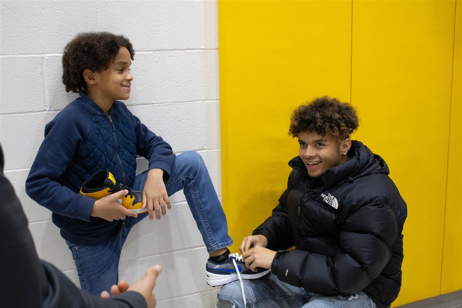 Students tying shoes