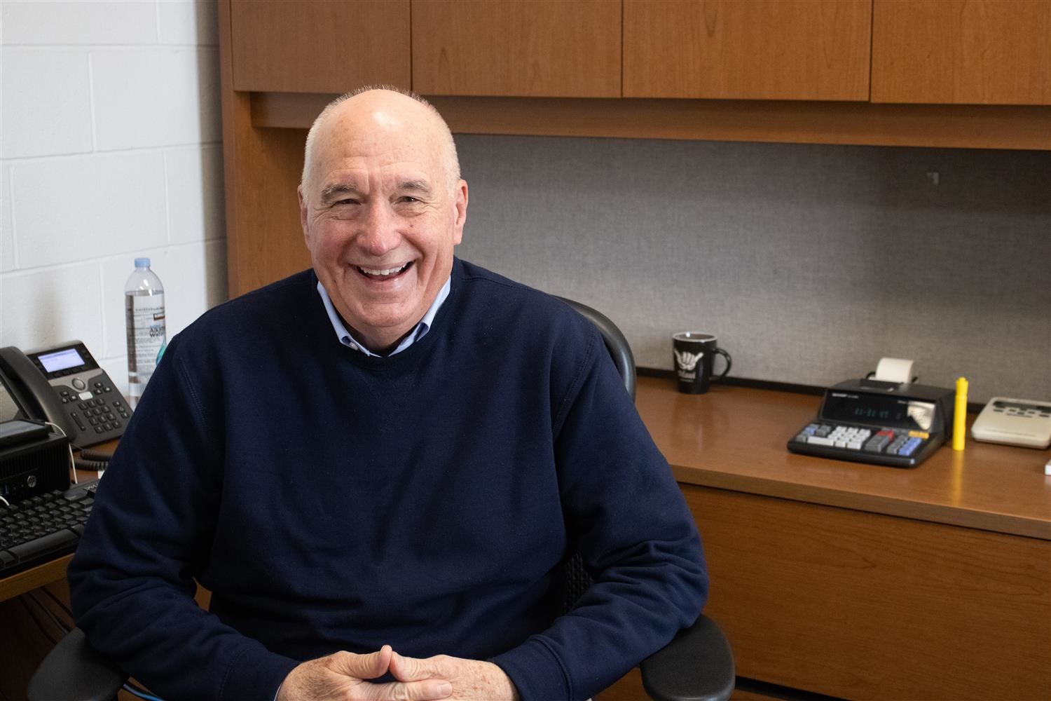 Elderly man smiling into camera