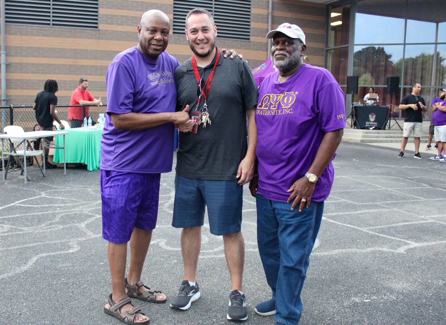 three men standing side by side