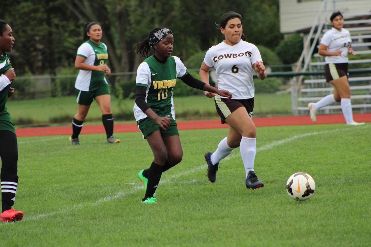 Julianne Lukambo playing soccer