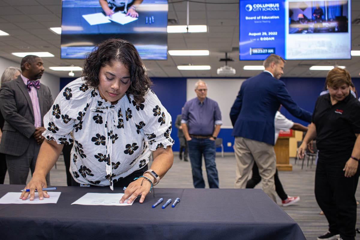 President Adair signing contract