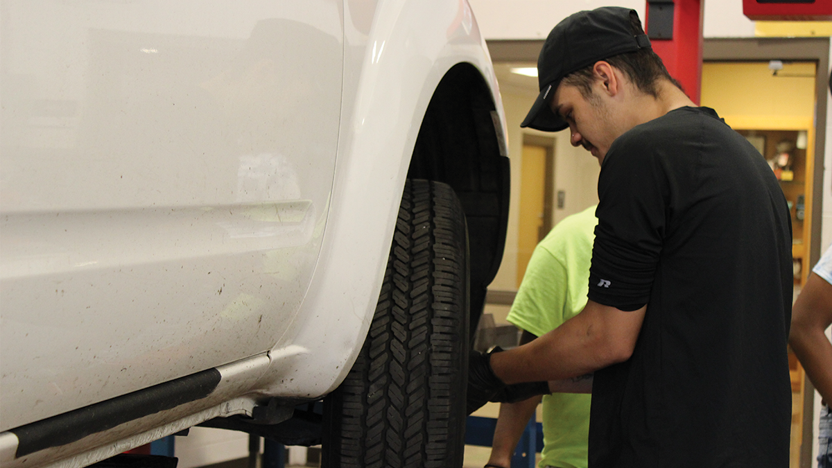 Student works on a car