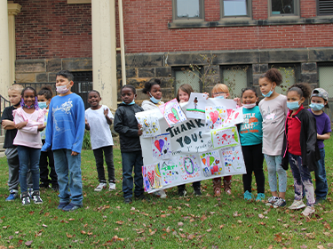 Students say "thank you" for the book donation