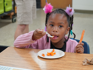  Easthaven student eats fresh carrots