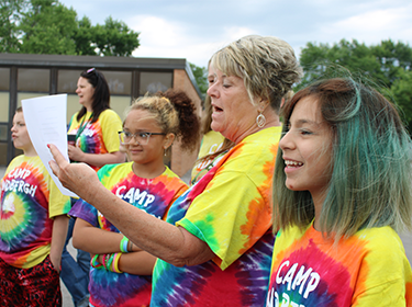 Teacher speaks with students at Lindbergh Elementary School