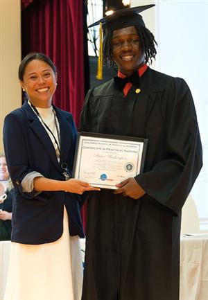 man holding diploma