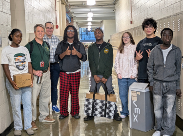 Northland students pose for a photo with John Kellar and Rich Granger