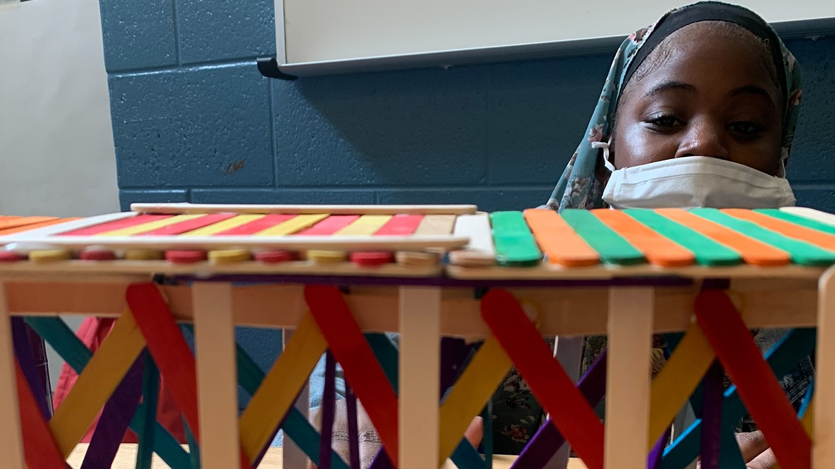 Sticks design a bridge using popsicle sticks