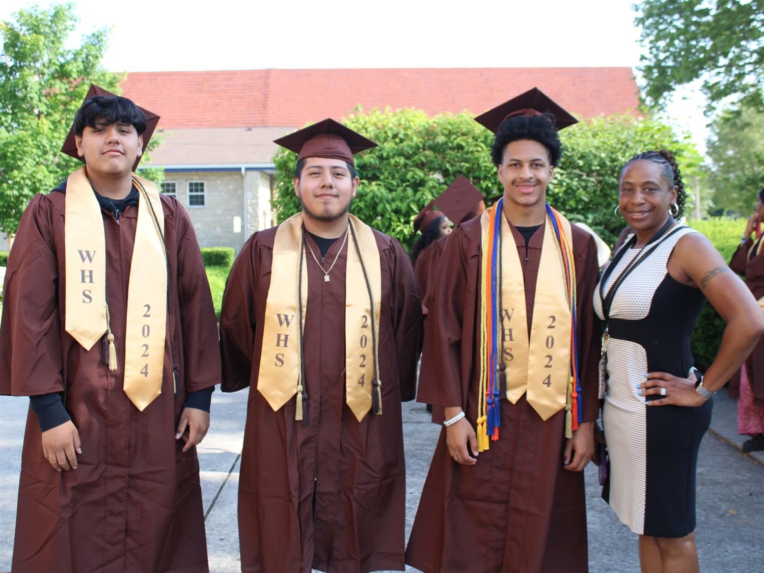 students wearing caps and gowns