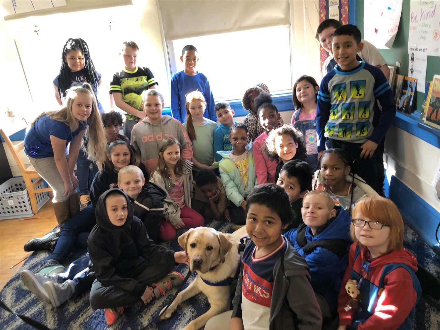 3rd graders visit with the CPD Therapy Dog Unit