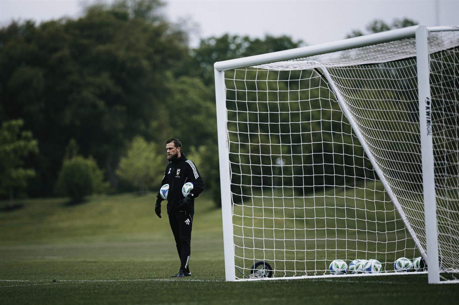 soccer manager with soccer balls